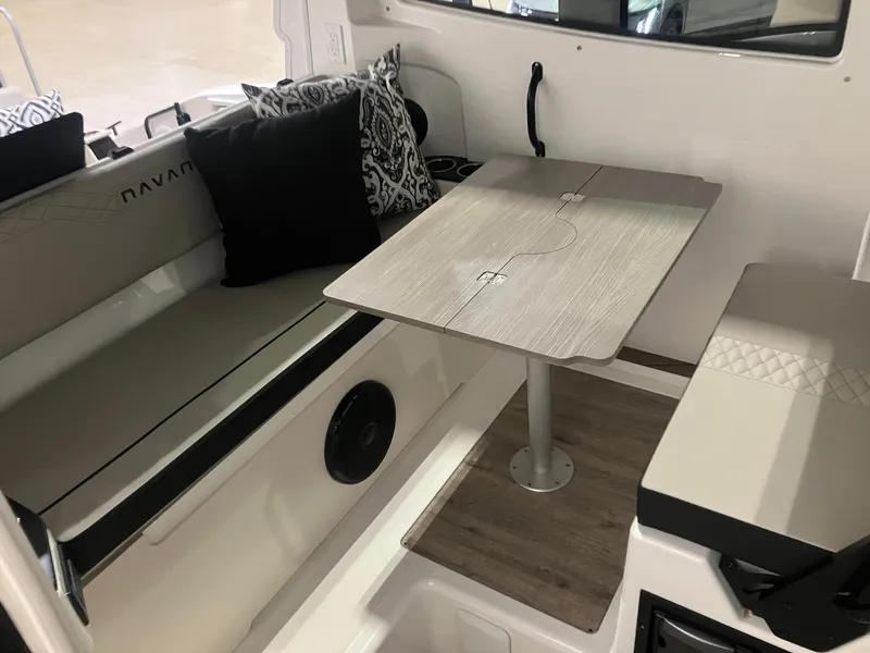Slide: The Image of Interior of 2025 Navan C30 boat with seating and a foldable table. - 4