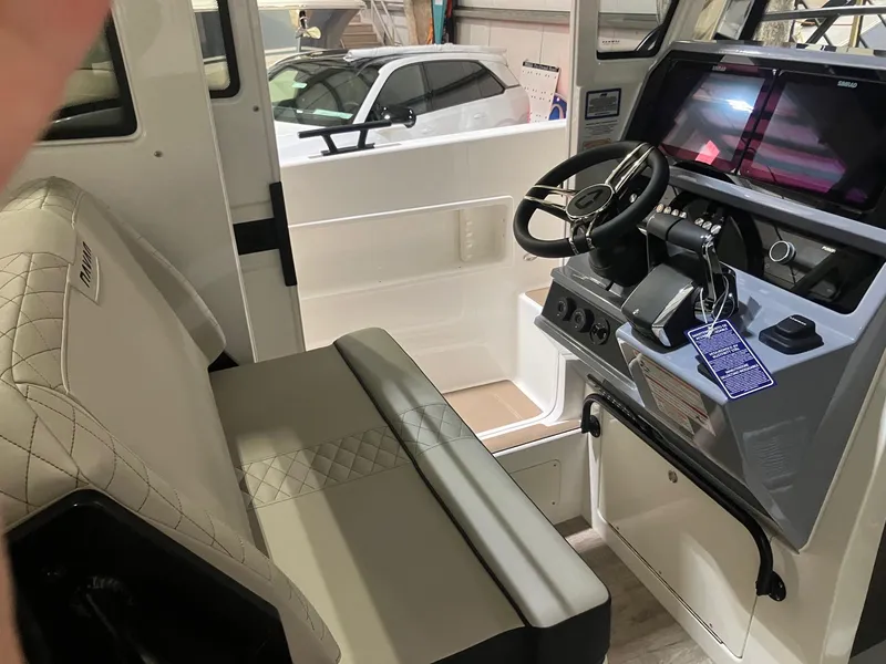 Slide: The Image of Interior of 2025 Navan C30 boat with modern steering and seating. - 5