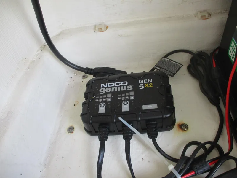 Slide: The Image of NOCO Genius GEN5X2 battery charger in 2022 Cobia 237 Center Console boat. - 11
