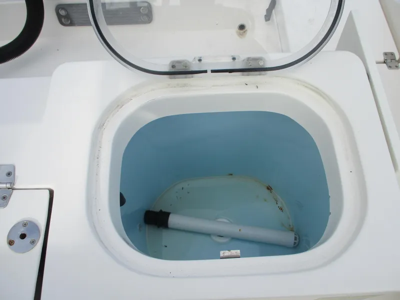 Slide: The Image of Livewell compartment on a 2022 Cobia 237 Center Console boat. - 13
