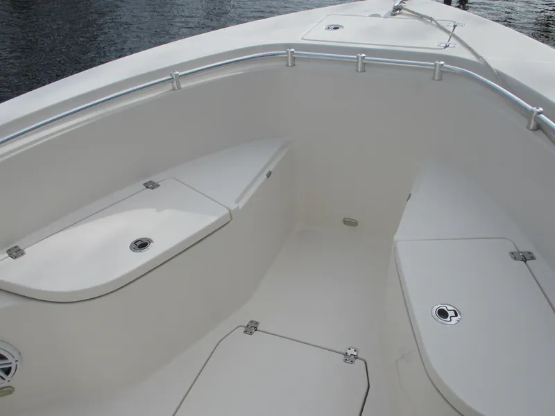 Slide: The Image of 2022 Cobia 237 Center Console boat interior with seating and storage compartments. - 21