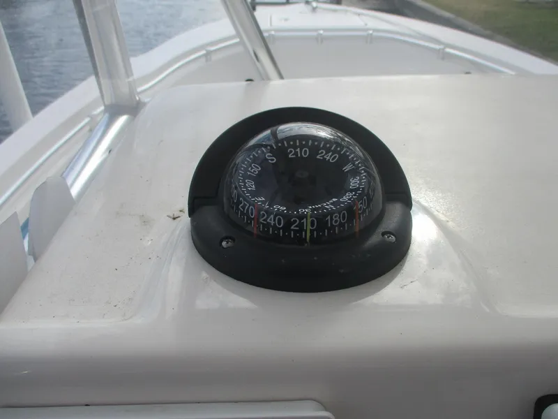Slide: The Image of Compass on 2022 Cobia 237 Center Console boat dashboard. - 34