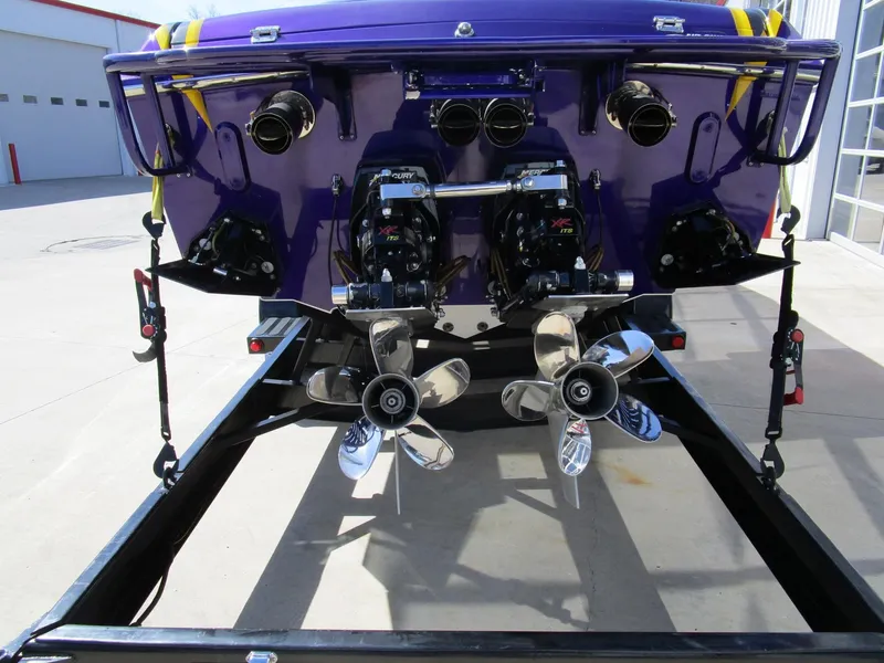 Slide: The Image of Steering wheel and controls of a 2005 Cigarette 39 Top Gun boat. - 10