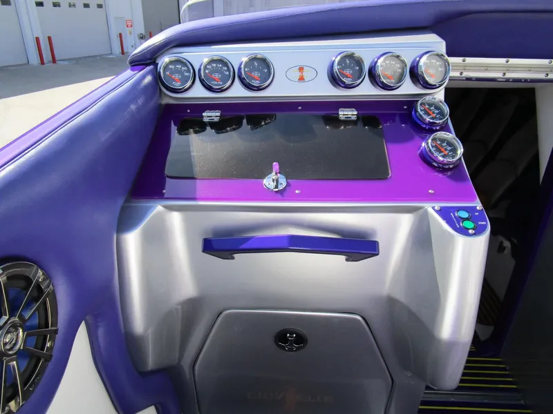 Slide: The Image of Engine compartment of a 2005 Cigarette 39 Top Gun boat with dual blue engines. - 23