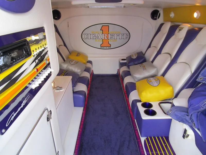 Slide: The Image of Engine compartment of a 2005 Cigarette 39 Top Gun boat with blue components. - 25