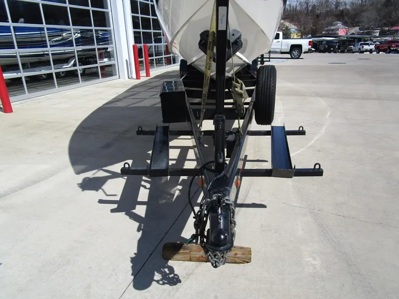 Slide: The Image of 2005 Cigarette 39 Top Gun boat with vibrant purple and yellow design on trailer. - 4