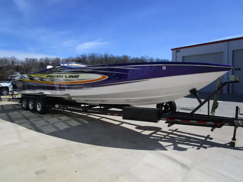 Slide: The Image of 2005 Cigarette 39 Top Gun boat with vibrant yellow and purple design, "World Champion" logo. - 6