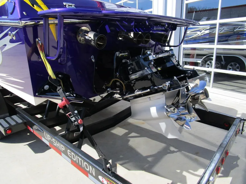 Slide: The Image of 2005 Cigarette 39 Top Gun boat dashboard with gauges, steering wheel, and controls. - 9