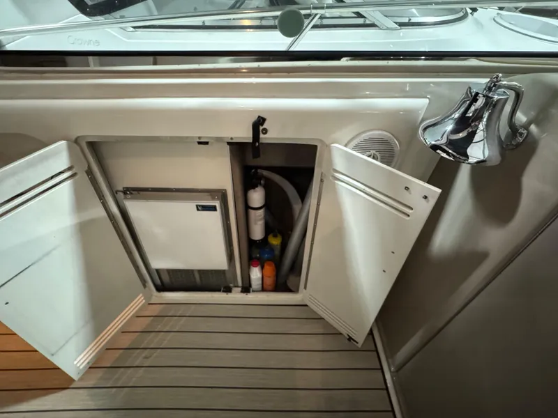 Slide: The Image of 1999 Sea Ray 400 Sundancer cockpit with steering wheel and control panel. - 11