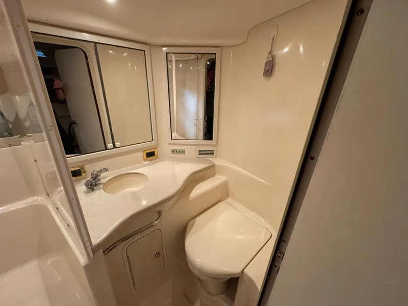 Slide: The Image of Engine room of 1999 Sea Ray 400 Sundancer with visible machinery and components. - 23