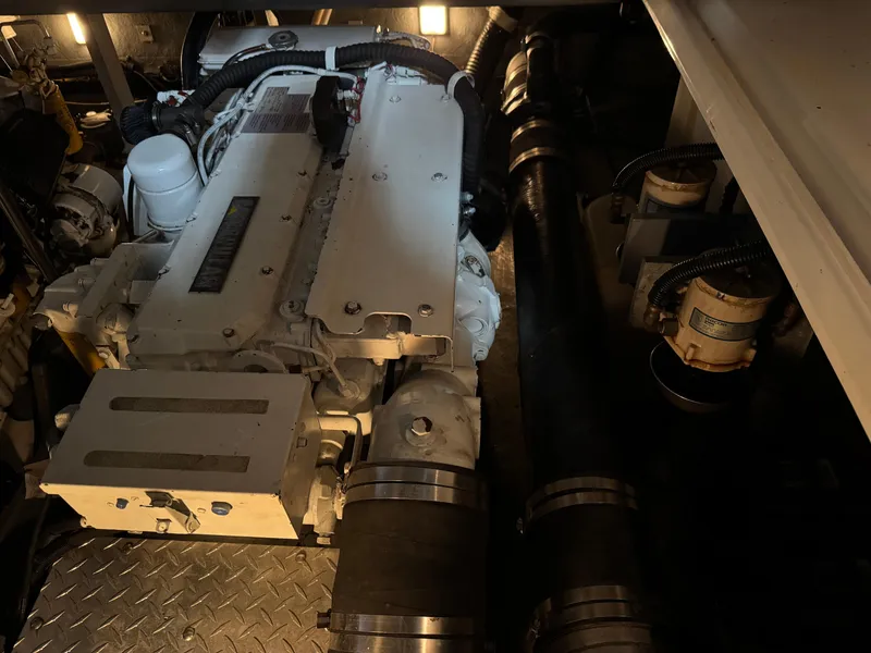 Slide: The Image of Engine room of a 1999 Sea Ray 400 Sundancer yacht, showcasing dual engines. - 24