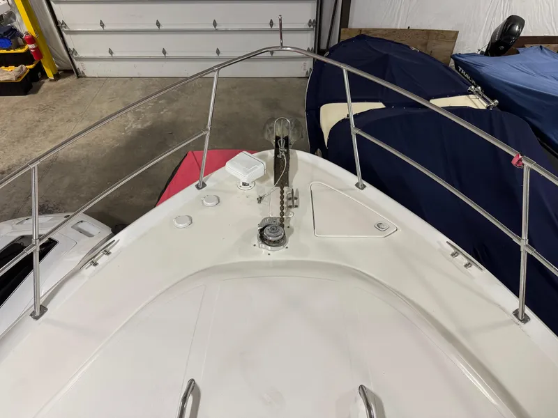 Slide: The Image of 1999 Sea Ray 400 Sundancer yacht in storage, surrounded by other boats. - 29