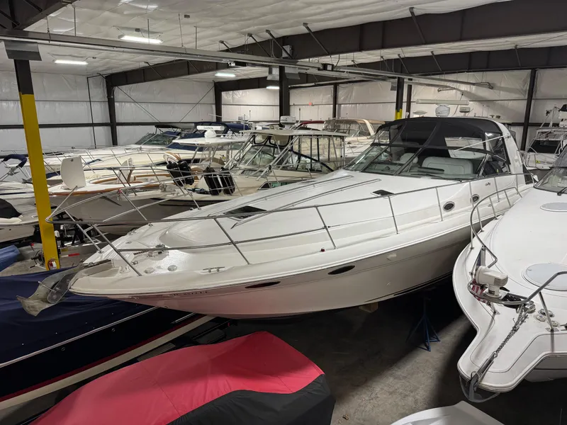 Slide: The Image of 1999 Sea Ray 400 Sundancer propeller on wooden blocks in a garage. - 33