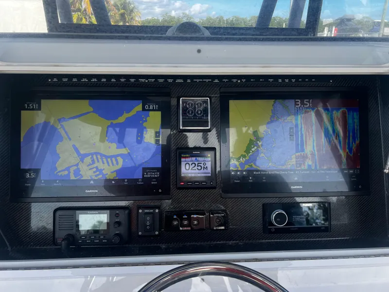 Slide: The Image of Control panel of a 2019 SeaHunter 35 Tournament boat with navigation displays and instruments. - 17
