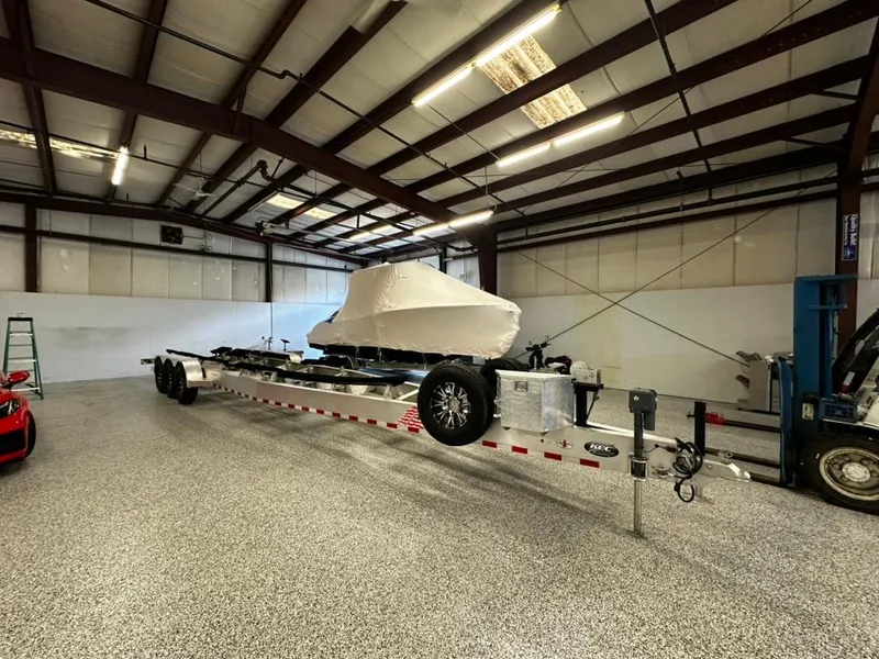 Slide: The Image of 2011 Cigarette 39 TOP FISH boat on trailer in spacious indoor storage facility. - 10