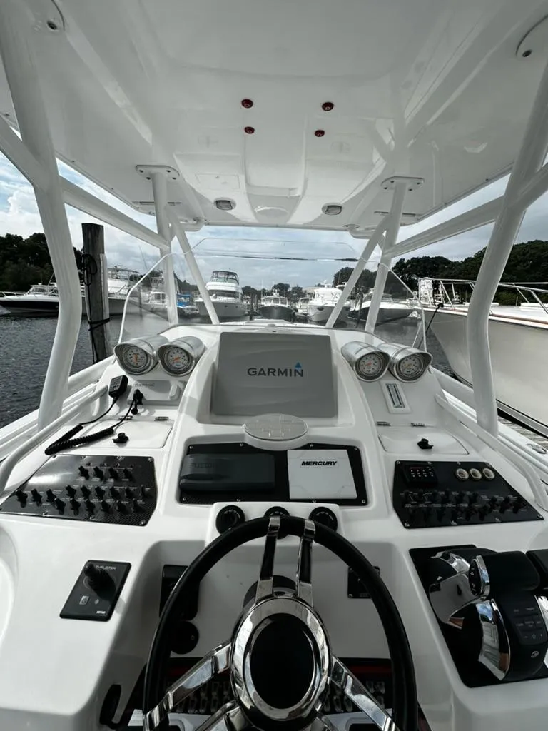 Slide: The Image of 2011 Cigarette 39 TOP FISH boat dashboard with Garmin navigation system. - 4