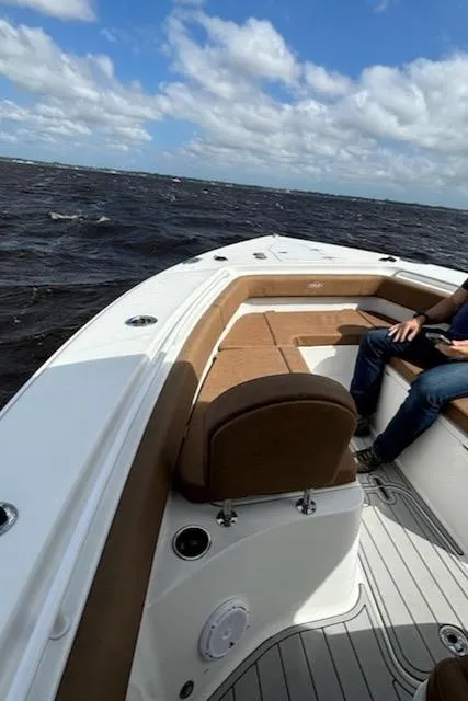 Slide: The Image of 2022 Sea Hunt Gamefish 27 boat with forward seating on open water. - 4