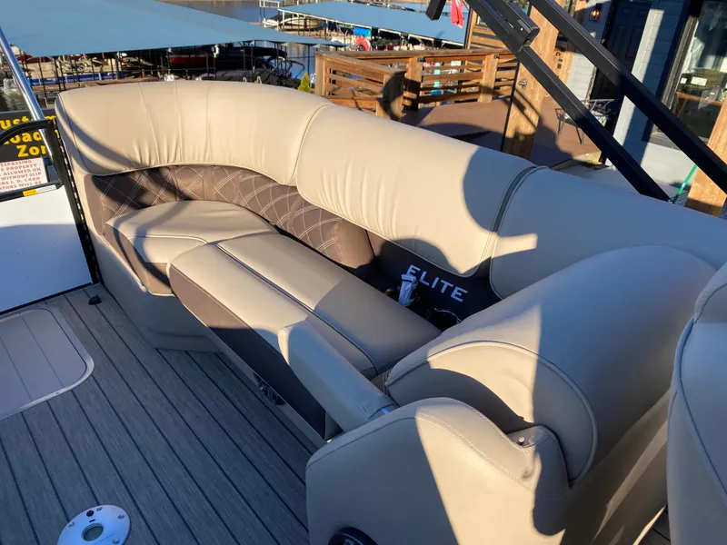 Slide: The Image of Luxurious seating on 2025 SunCatcher Elite 324 SS boat, featuring elegant beige upholstery. - 14