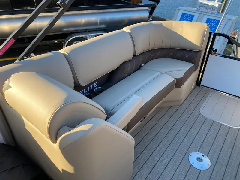 Slide: The Image of Luxurious seating on 2025 SunCatcher Elite 324 SS boat, featuring elegant beige upholstery. - 17