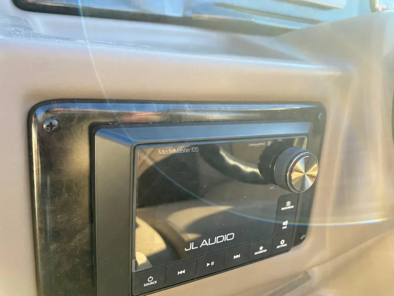 Slide: The Image of JL Audio system in 2025 SunCatcher Elite 324 SS boat dashboard. - 8