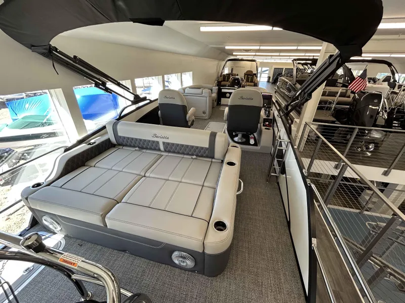 Slide: The Image of 2025 Barletta Lusso 23UC pontoon boat interior with luxurious seating and modern design. - 4