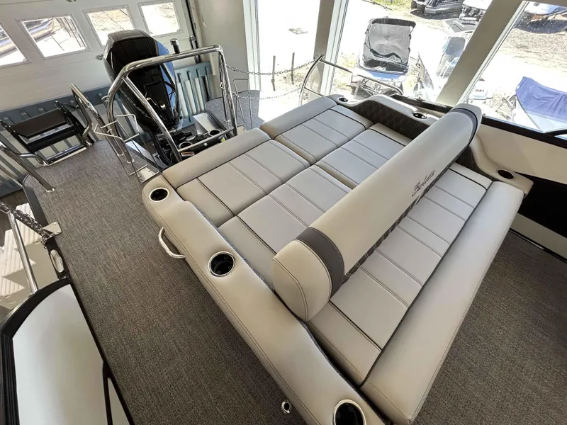 Slide: The Image of 2025 Barletta Lusso 23UC pontoon boat interior with luxurious seating and modern design. - 5
