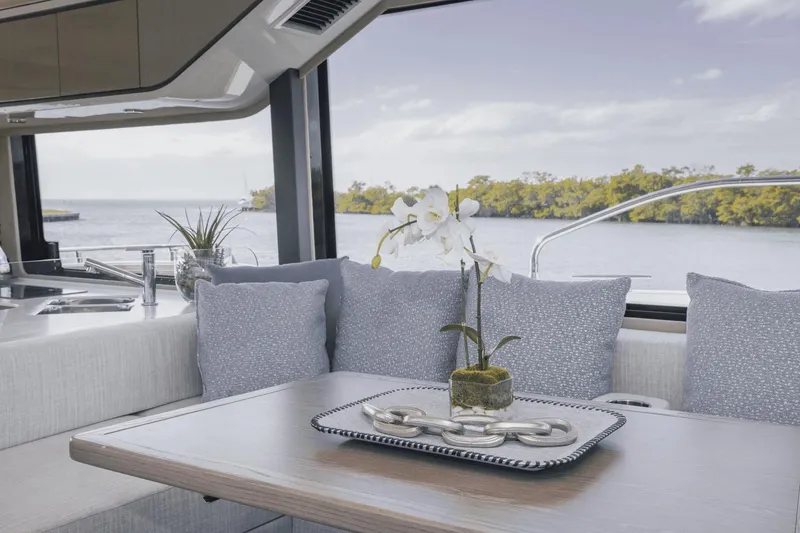 Slide: The Image of Luxurious interior of 2025 Cruisers Yachts 57 Fly with elegant decor and scenic view. - 35
