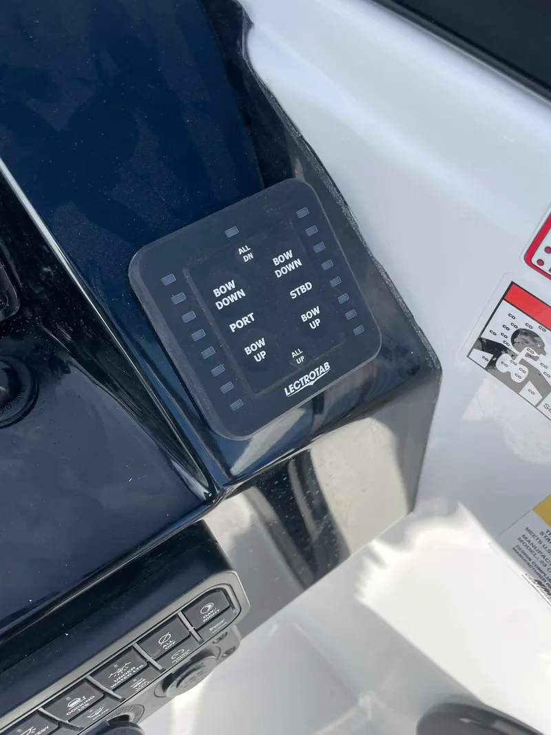 Slide: The Image of Control panel of 2025 Stingray 23 OSX boat with MicroTrol system. - 21