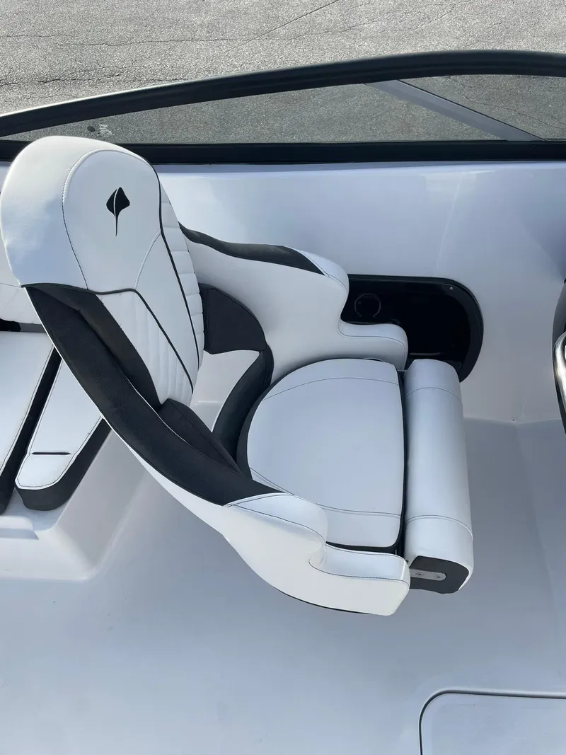 Slide: The Image of 2025 Stingray 23 OSX boat seat, featuring sleek white and black design. - 25
