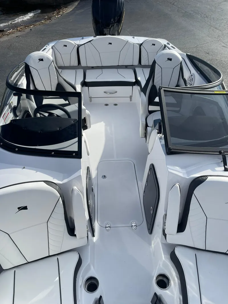 Slide: The Image of 2025 Stingray 23 OSX boat interior with modern seating and sleek design. - 33