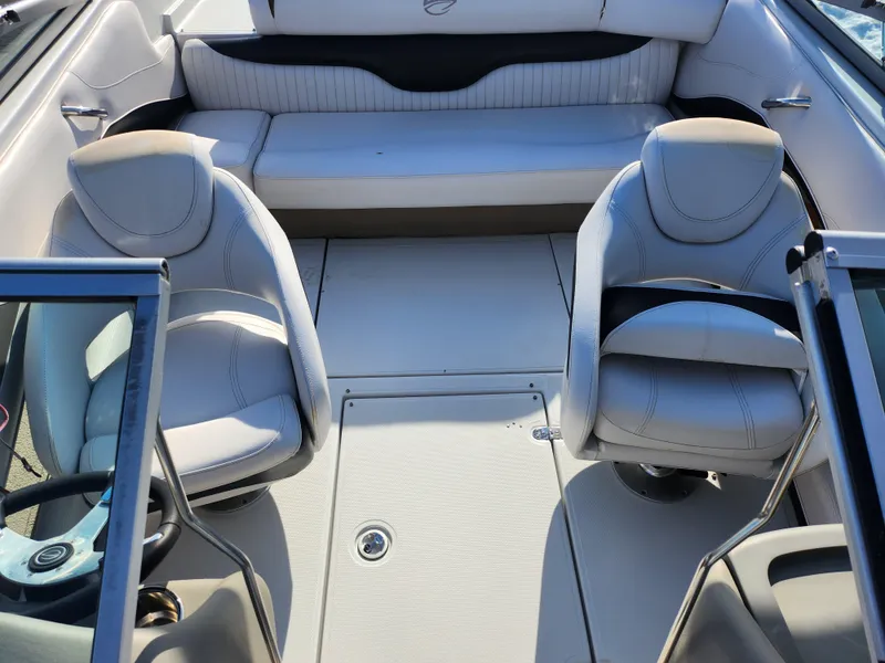 Slide: The Image of 2012 Crownline 21 SS boat interior with seating and steering wheel. - 19