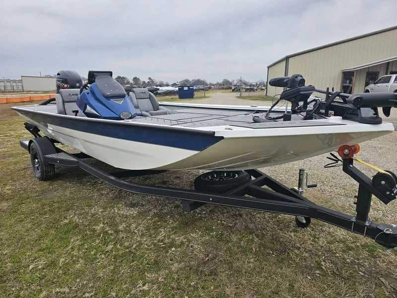 Slide: The Image of 2025 Avid 18 Vertex Crappie fishing boat on trailer, parked outdoors. - 11