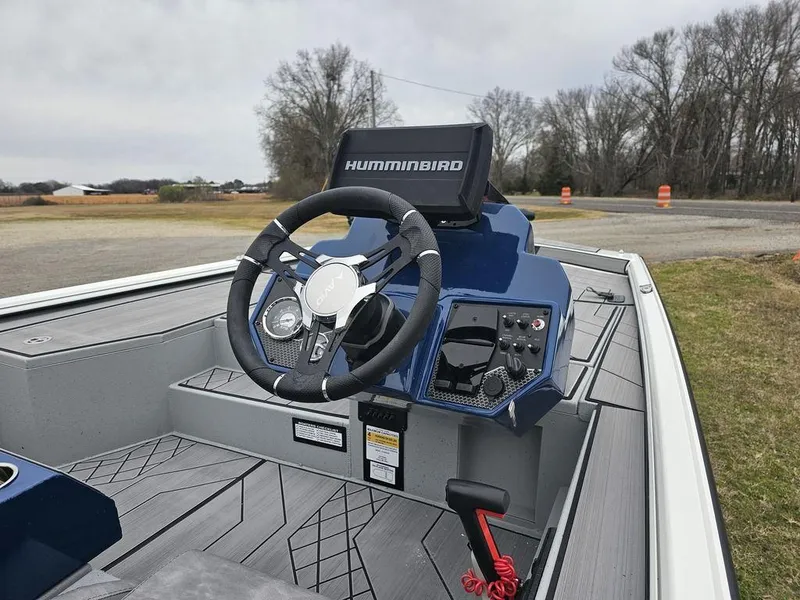 Slide: The Image of 2025 Avid 18 Vertex Crappie boat dashboard with Humminbird electronics and steering wheel. - 7