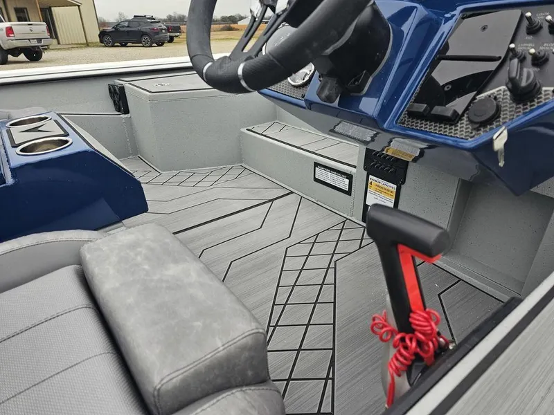 Slide: The Image of Interior of 2025 Avid 18 Vertex Crappie boat with modern steering and seating. - 8