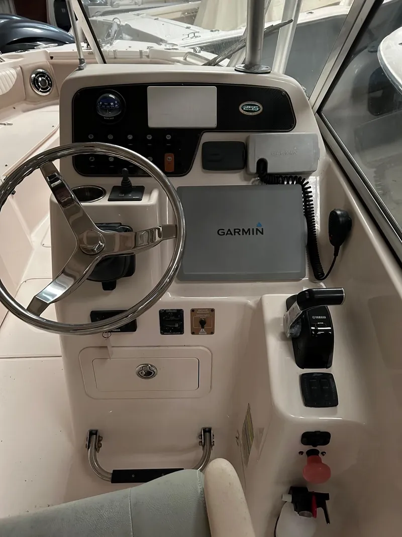 Slide: The Image of 2014 Grady-White Freedom 255 boat dashboard with Garmin navigation system. - 3
