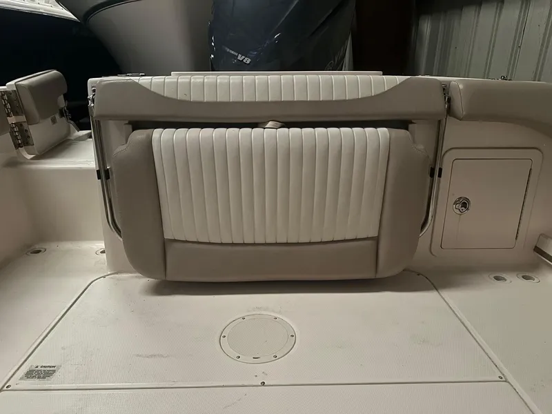 Slide: The Image of 2014 Grady-White Freedom 255 boat interior with white cushioned seating. - 5