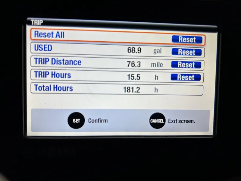 Slide: The Image of Display screen showing trip data: fuel used, distance, trip hours, and total hours for Grady-White Freedom 255. - 7