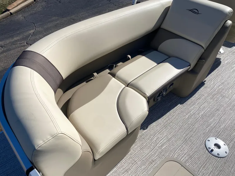 Slide: The Image of 2025 SunCatcher Select 322RC boat seating, beige upholstery, curved design. - 10