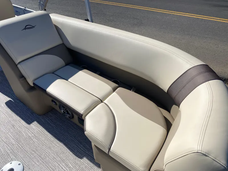 Slide: The Image of 2025 SunCatcher Select 322RC boat seating with beige upholstery and modern design. - 12