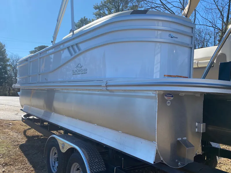 Slide: The Image of 2025 SunCatcher Select 322RC pontoon boat on trailer, side view. - 13