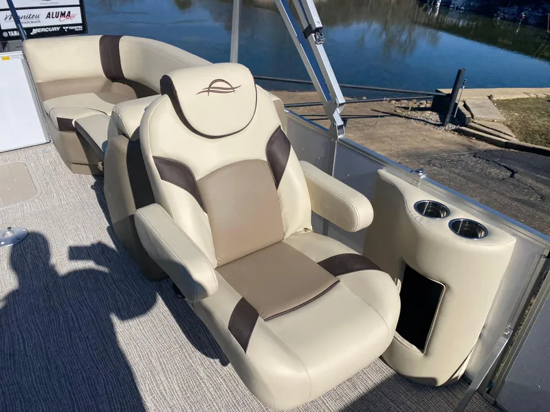 Slide: The Image of Luxurious seating on 2025 SunCatcher Select 322RC pontoon boat by the water. - 16