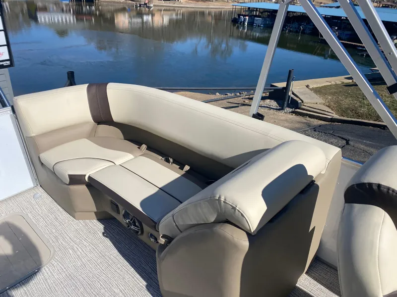 Slide: The Image of Luxurious seating on 2025 SunCatcher Select 322RC pontoon boat by a serene lake. - 20