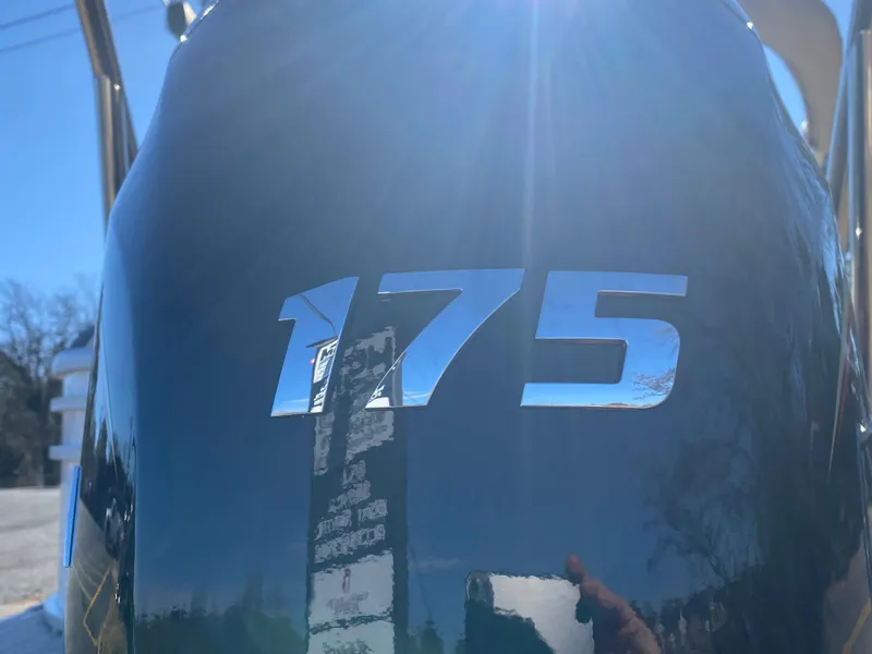 Slide: The Image of Close-up of 2025 SunCatcher Select 322RC with '175' engine detail in sunlight. - 30