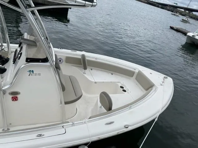 Slide: The Image of 2022 Key West 219 FS boat docked on calm water. - 1