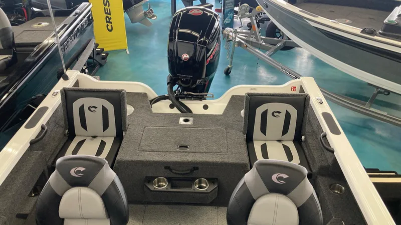 Slide: The Image of 2025 Crestliner 1750 Fish Hawk boat interior with seating and motor display. - 3