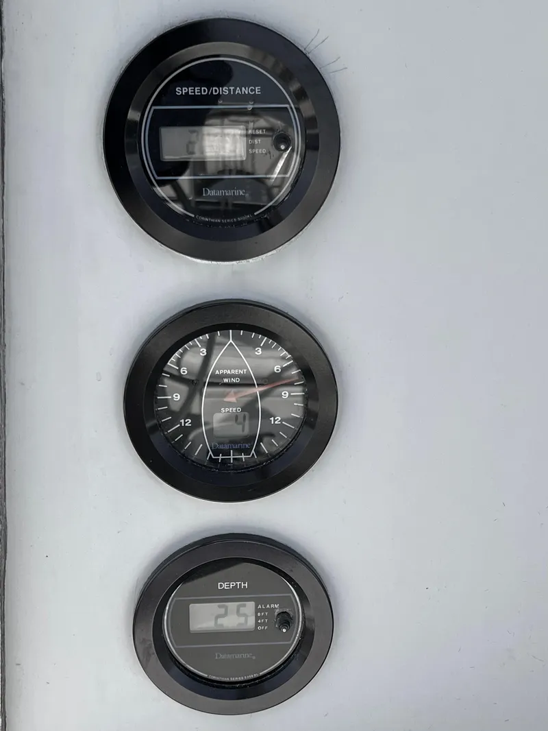 Slide: The Image of Three nautical gauges on a 1983 C&C 35 MKIII sailboat dashboard. - 13