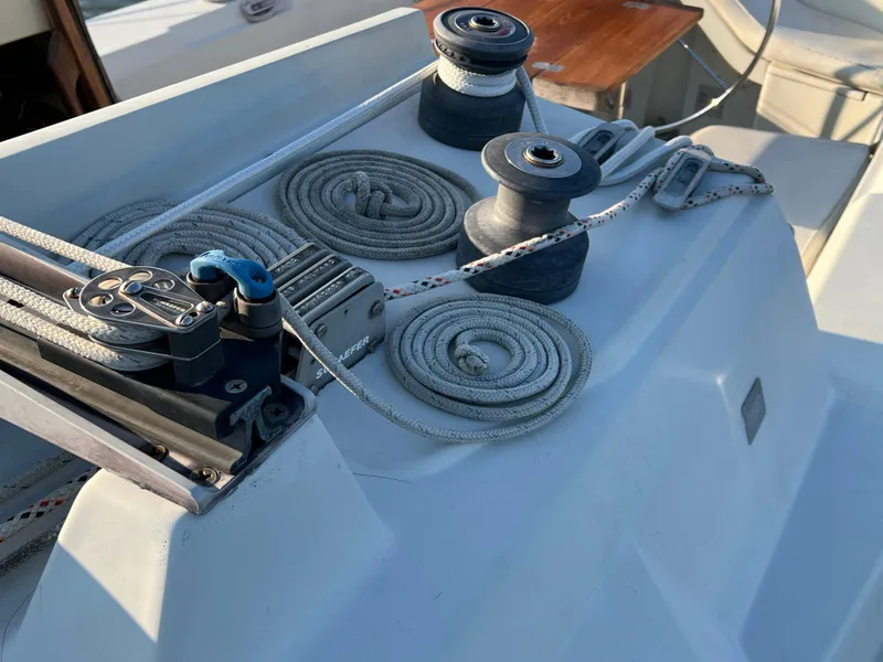Slide: The Image of Deck of 1983 C&C 35 MKIII sailboat with winches and coiled ropes. - 22