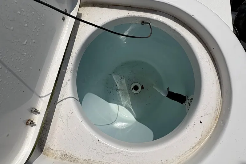 Slide: The Image of Livewell on a 2013 Tidewater 230 boat, filled with water. - 12