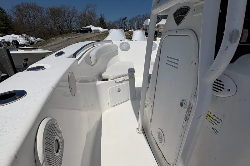 Slide: The Image of 2013 Tidewater 230 boat interior with seating and storage compartments. - 13