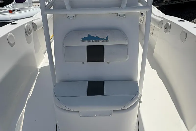 Slide: The Image of 2013 Tidewater 230 boat interior with seating and storage compartments. - 17